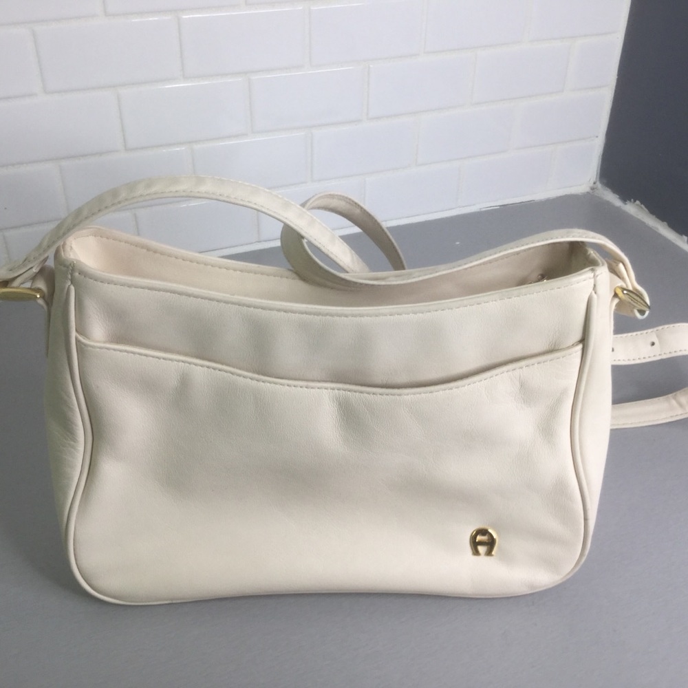 Etienne Aigner leather cream crossbody bags
